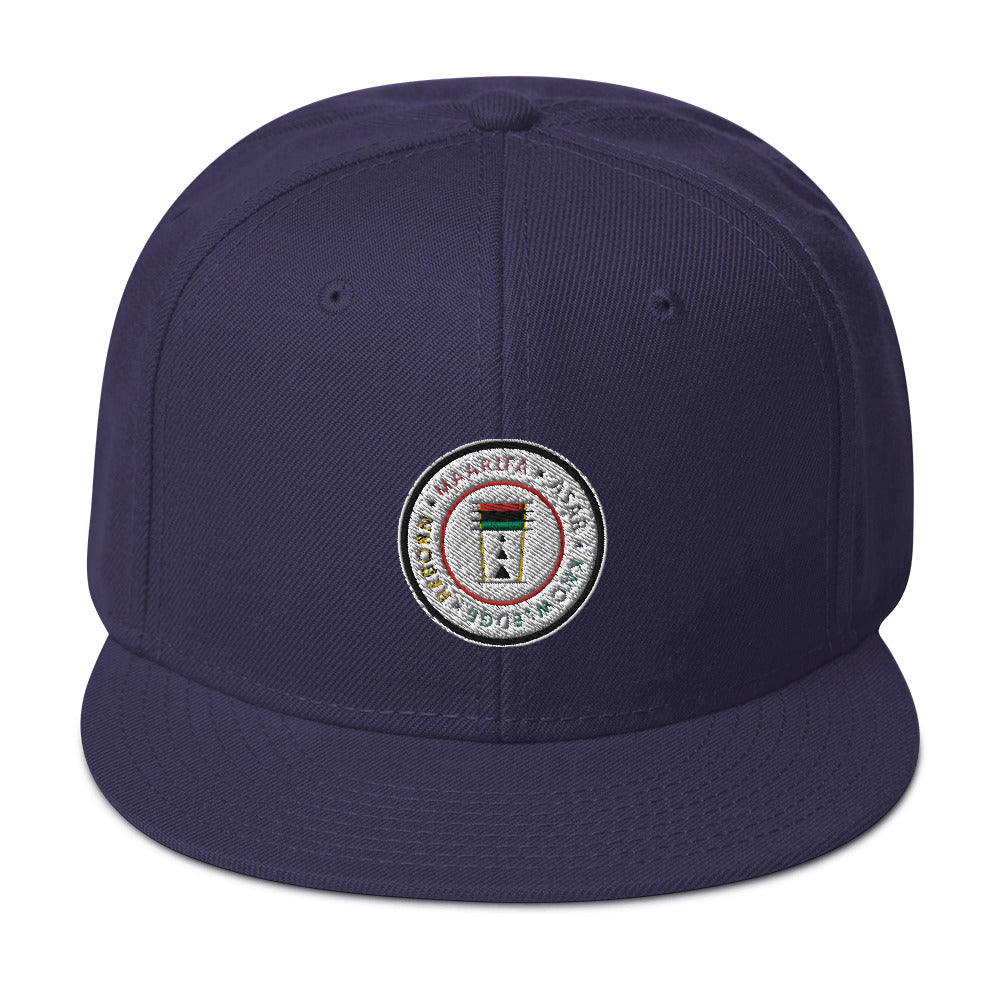 
                  
                    Load image into Gallery viewer, This is the snapback hat of your dreams! It&amp;#39;s structured and high-profile, with a flat visor and a subtle grey under visor.   • 85% acrylic, 15% wool • Structured, 6-panel, high-profile • Plastic snap closure • Grey under visor • Head circumference: 22”–24”
                  
                
