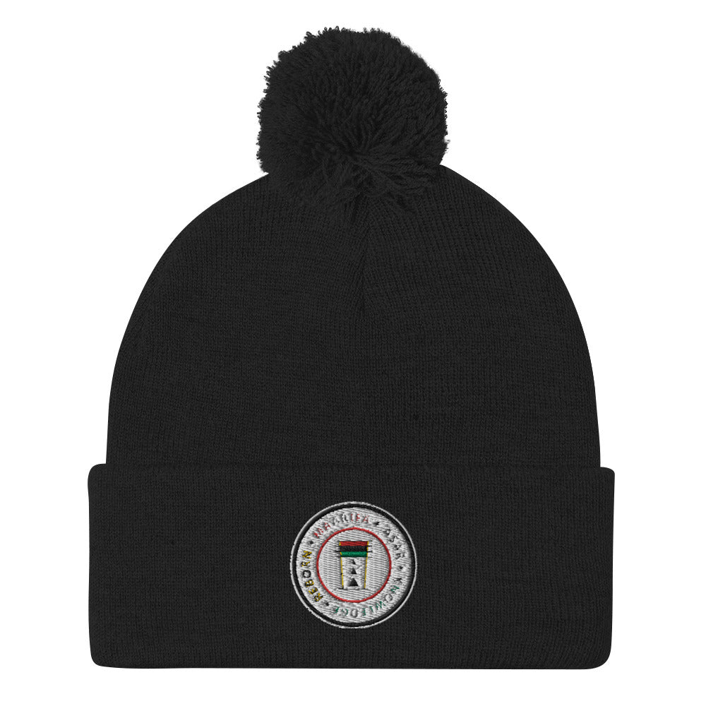 Expand your wardrobe with a classic embroidered beanie. Finished with a pom-pom on top, it offers tons of warmth and comfort, and is destined to find its way into all your favorite cold-weather looks.  • 100% acrylic • One size fits all • 12'' (30.5 cm) knit • Fold-over 3'' (7.6 cm) cuff • Pom-pom on top